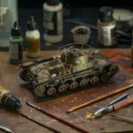 High-quality model tank surrounded by various painting supplies for a realistic diorama.